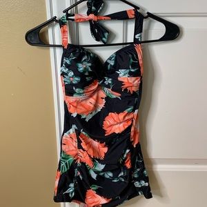 One piece floral swimsuit with shorts.